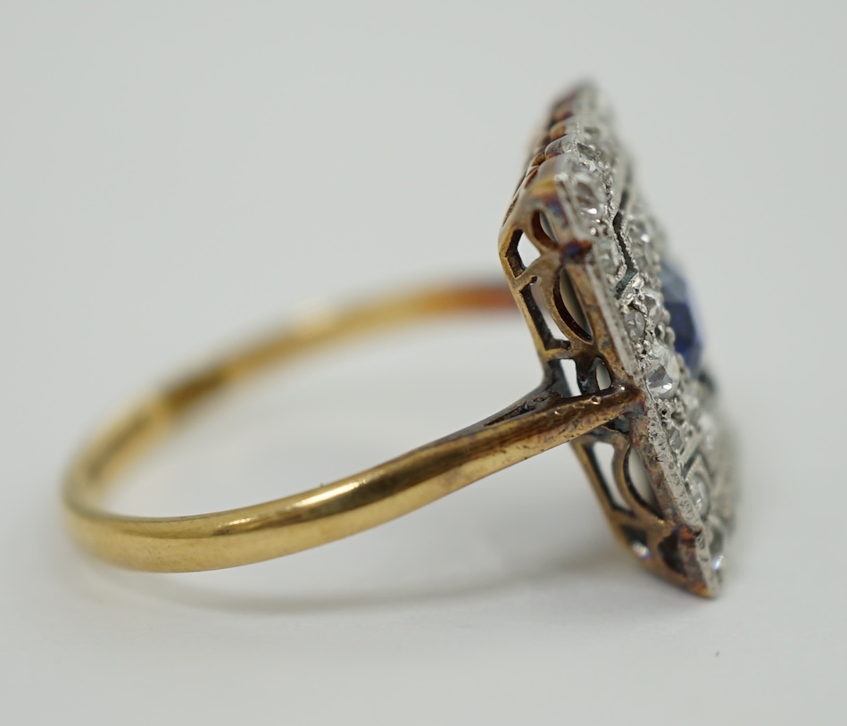 An early 20th century 18ct and platinum, millegrain set sapphire and diamond cluster tablet ring